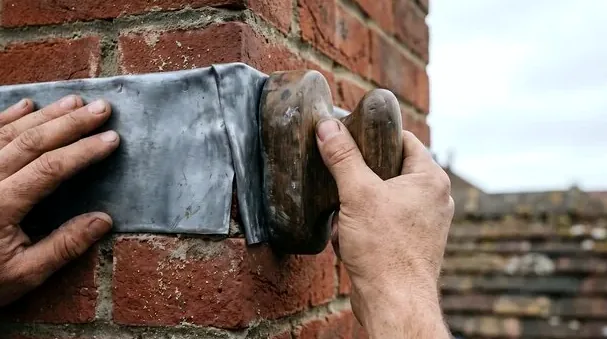 Resealing flashing at a chimney after a rain leak in Blacklick